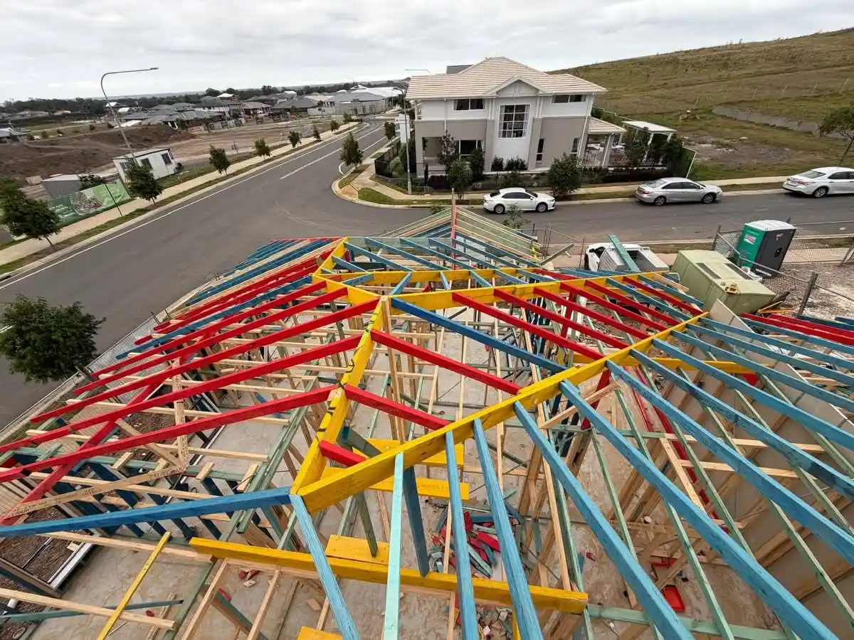 Aerial view of roof trusses and hip framing on a new house