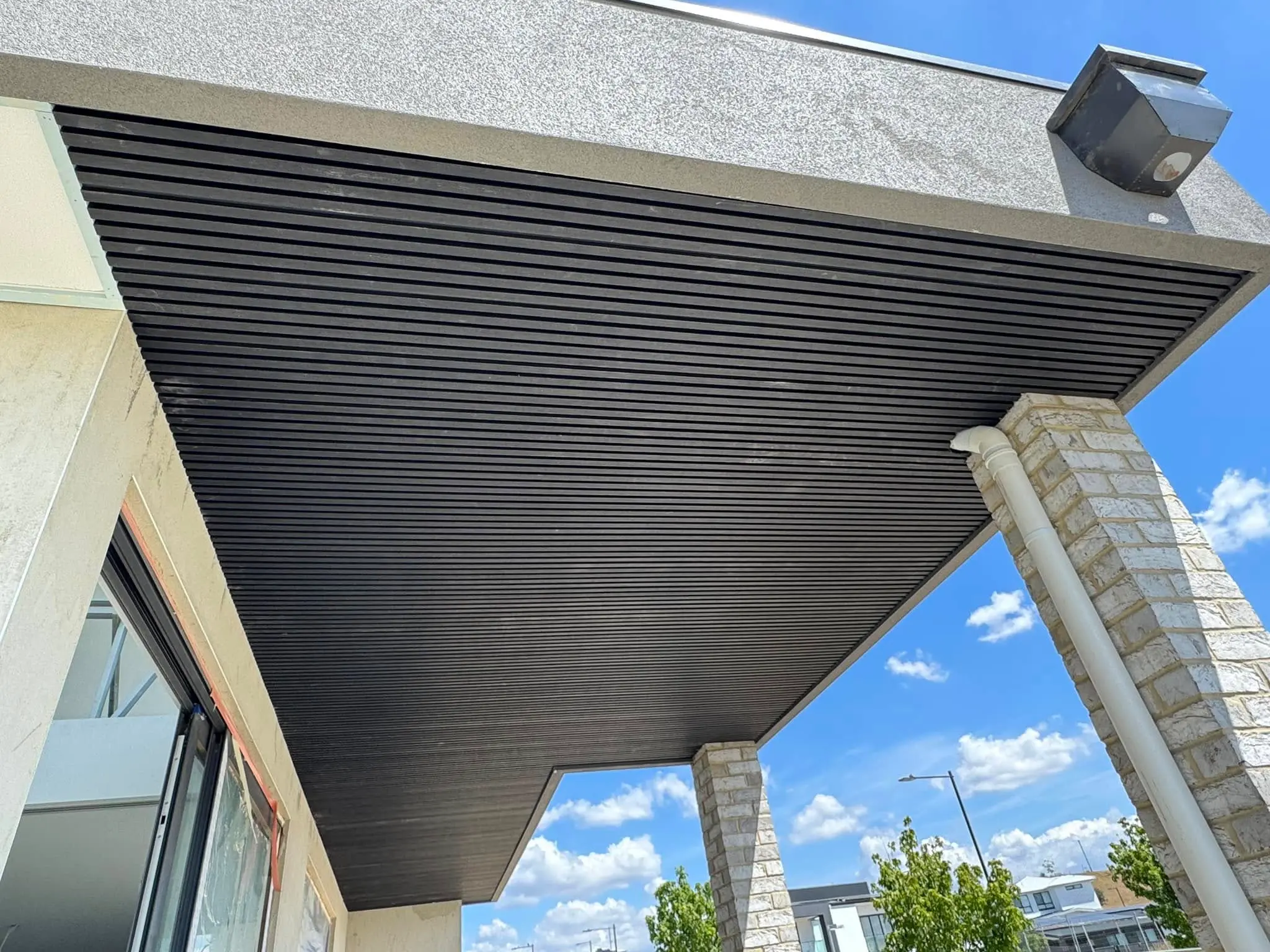 Black timber-look batten eave soffit finish