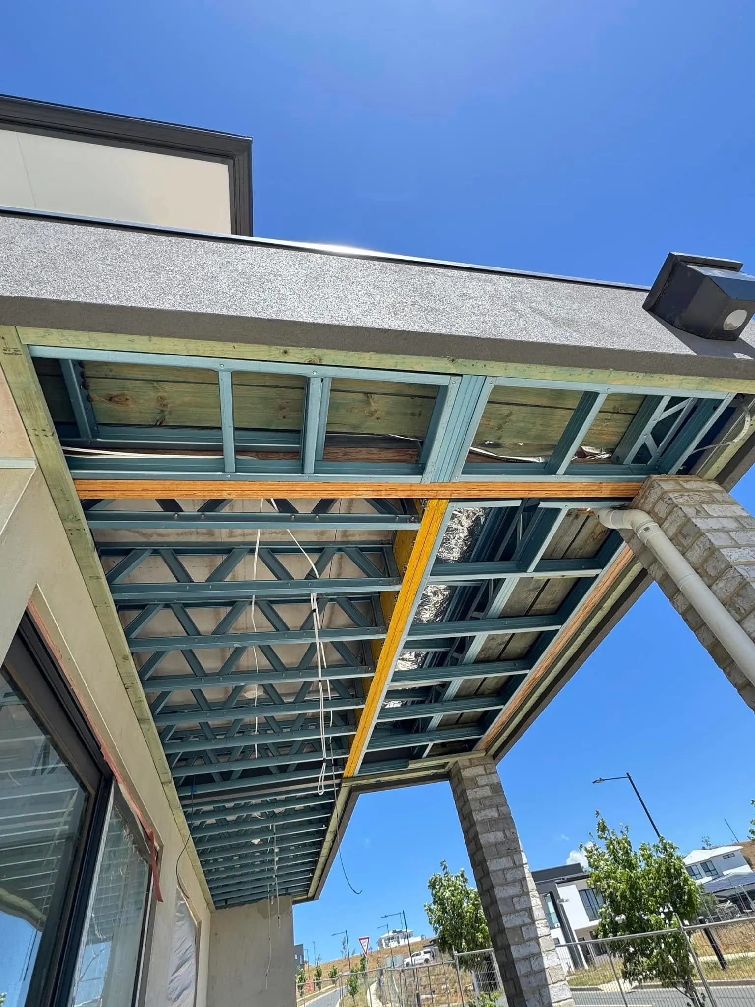Steel eave frame ready for black battens